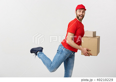 Delivery Concept - Handsome caucasian delivery man rush running for delivering a package for Delivery Concept - Handsome caucasian delivery man rush running for delivering a package for 40210229
