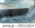 Water flowing in city fountain 40211814