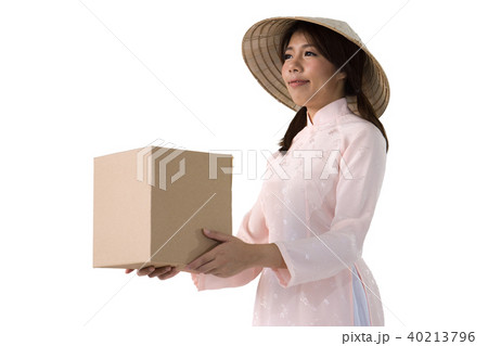 woman in pink dress and vietnam hat holding box 40213796