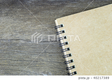 Brown notebook placed on old wooden floor. Brown notebook placed on old wooden floor. 40217389