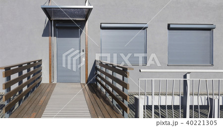 Metal blind on the doors and windows of the facade 40221305