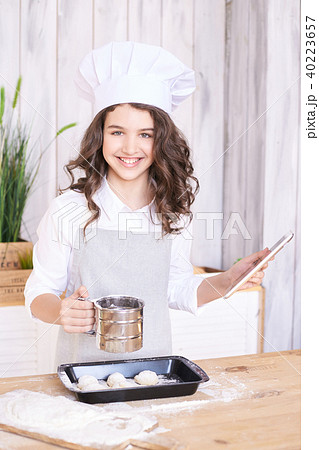 Light wooden background. Cooking buns. Light wooden background. Cooking buns. 40223657