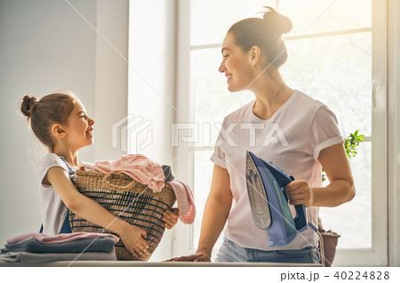 mother and daughter ironing at home mother and daughter ironing at home 40224828