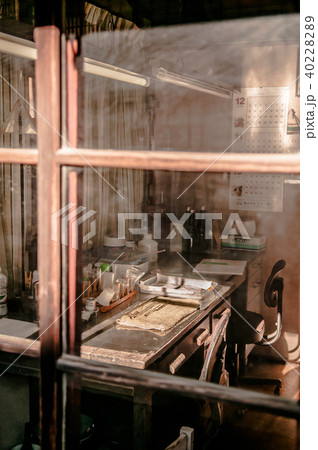 Old grunge working desk, chair and books Old grunge working desk, chair and books 40228289