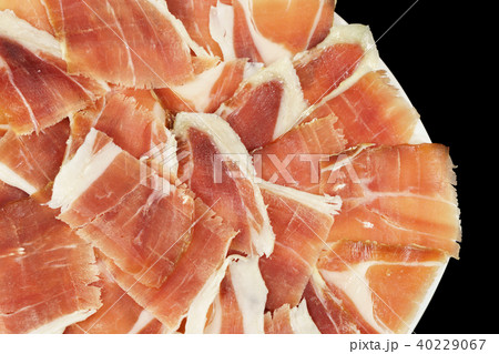 Acorn ham plate closeup with black background, top view 40229067