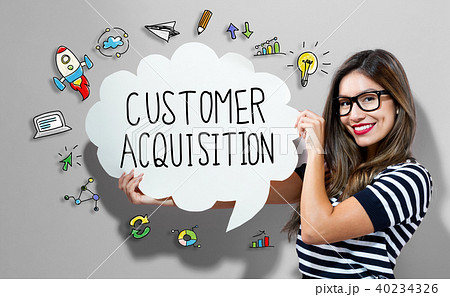 Customer Acquisition text with woman holding a speech bubble 40234326