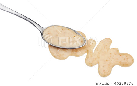 Sesame sauce with spoon isolated on white background 40239576