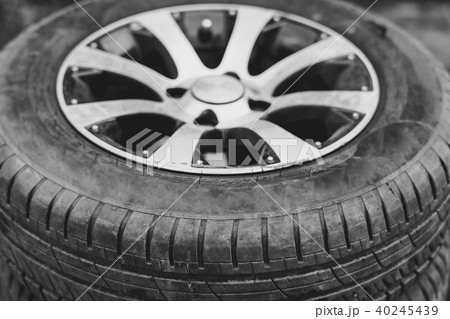 car tire with alloy wheel lies 40245439