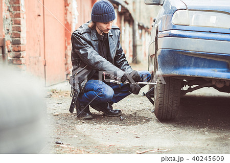 man changing wheel on a car 40245609