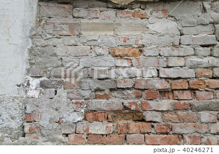 Weathered red brick wall background with spots Weathered red brick wall background with spots 40246271