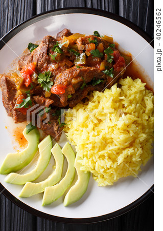 Seco de chivo is goat stew with yellow rice 40246562