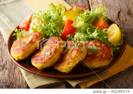 Serving fresh Ecuadorian potato pancakes Serving fresh Ecuadorian potato pancakes 40246574