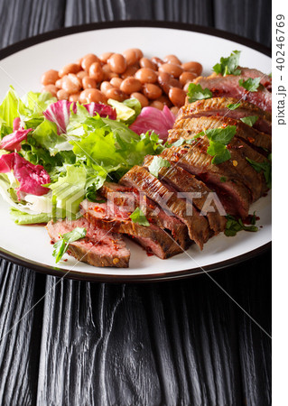 Grilled beef steak with green salad and beans Grilled beef steak with green salad and beans 40246769