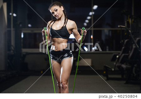 brunette athletic young girl working out in gym brunette athletic young girl working out in gym 40250804