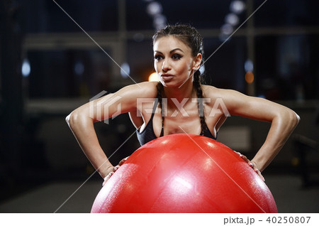 brunette athletic young girl working out in gym 40250807