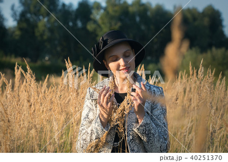 woman in dry grass woman in dry grass 40251370