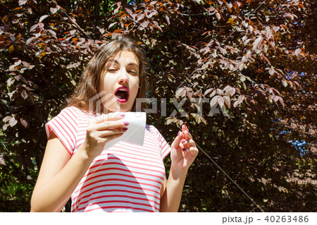 allergy concept. Sneezing girl with nose wiper allergy concept. Sneezing girl with nose wiper 40263486