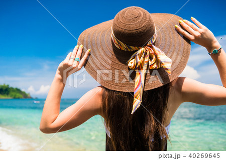Woman enjoying the view at the beach or ocean Woman enjoying the view at the beach or ocean 40269645