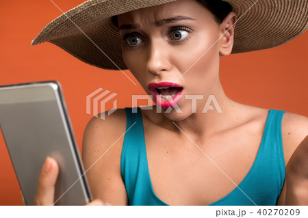 Nice woman receiving shocking news by phone Nice woman receiving shocking news by phone 40270209