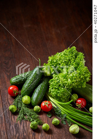 Fresh vegetables composition over wooden background, close-up, flat lay. 40271047