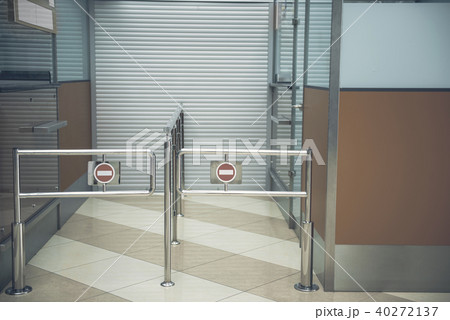 Silver metal structures opposite closed entrance 40272137