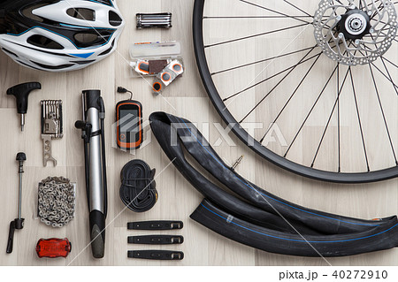 Picture of bicycle objects on wooden background. 40272910