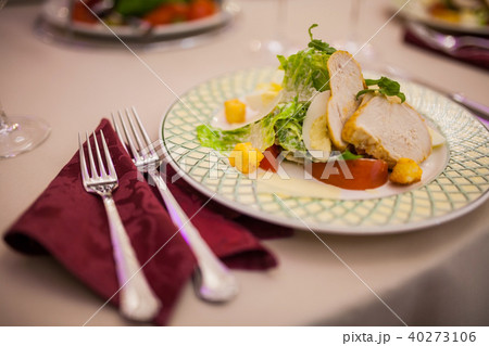 On the table Caesar salad with cutlery On the table Caesar salad with cutlery 40273106
