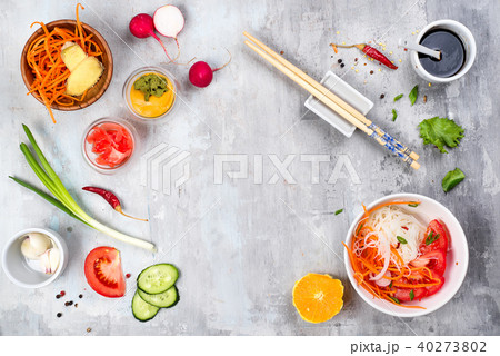 Spicy glass noodles with vegetables - carrots, cucumber, peppers, garlic. Spicy glass noodles with vegetables - carrots, cucumber, peppers, garlic. 40273802