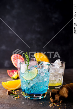 Blue Hawaiian Lagoon Cocktail with malibu rum, blue curacao, vodka, tequila,orange juice and mint on 40273852