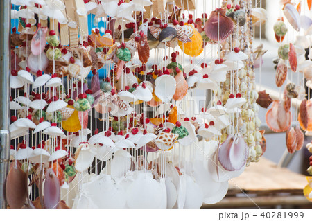 Hanging decor by sea shells at street shops. 40281999