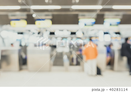 BlurredTraveler with baggage check in counter 40283114
