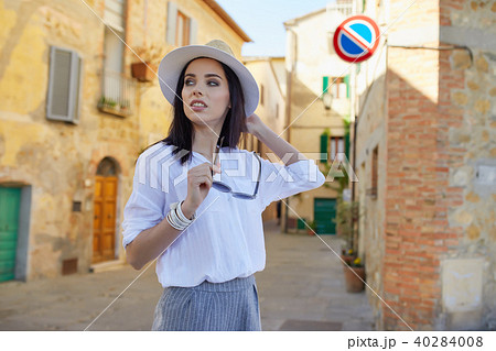 Young tourist woman walks in the old town. Italy. Young tourist woman walks in the old town. Italy. 40284008