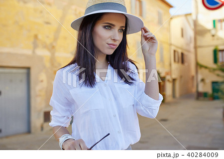 Young tourist woman walks in the old town. Italy. Young tourist woman walks in the old town. Italy. 40284009