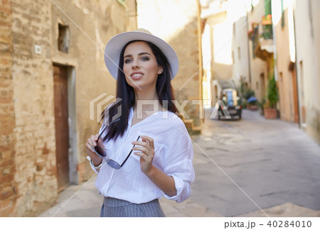 Young tourist woman walks in the old town. Italy. Young tourist woman walks in the old town. Italy. 40284010