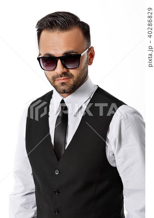man in black suit on white background. 40286829