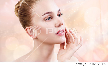 Beautiful sensual woman over beige blurry background. Beautiful sensual woman over beige blurry background. 40287343