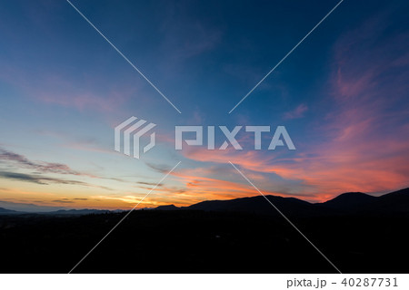 Cloudscape after sunset above the silhouette hills Cloudscape after sunset above the silhouette hills 40287731