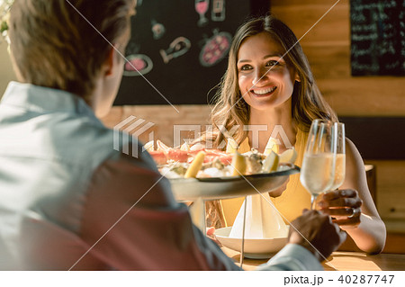 Happy couple in love toasting with champagne during romantic dinner 40287747