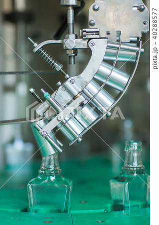Bottles with a drink closed with a screw cap. Factory for the production of alcoholic beverages 40288577