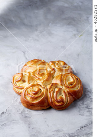 Homemade rose bread on white textured background, close-up, shallow depth of field, top view 40292531