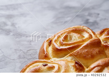 Homemade rose bread on white textured background, close-up, shallow depth of field, top view 40292532