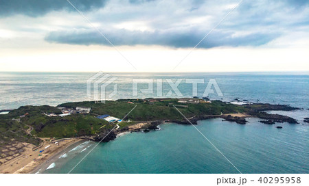 Aerial view of sandy beach with tourists swimming  40295958
