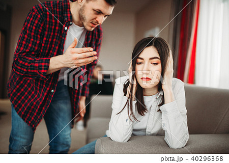 Angered husband yells on wife, family quarrel 40296368