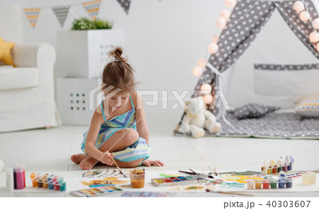 cute child girl paints at home 40303607