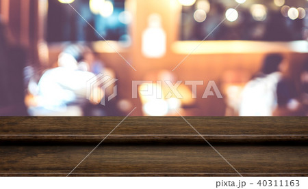 wood table top food stand with blur people dinning wood table top food stand with blur people dinning 40311163