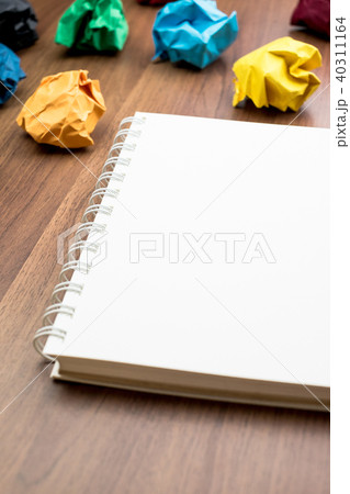 open white book with group of colorful crumple open white book with group of colorful crumple 40311164