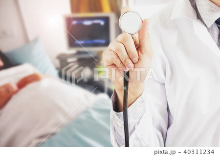 Doctor with stethoscope on hospital background Doctor with stethoscope on hospital background 40311234