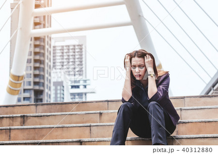 Unemployed businesswoman sit on stair Unemployed businesswoman sit on stair 40312880