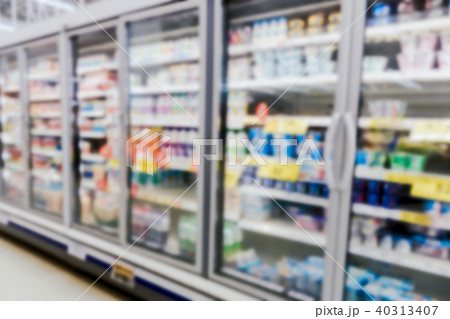Commercial refrigerators in large supermarket blur Commercial refrigerators in large supermarket blur 40313407