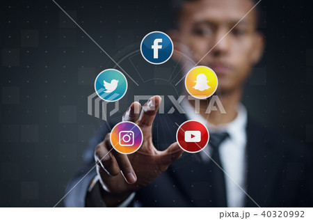 Asian Man Pressing Virtual Screen of Popular Social Media Asian Man Pressing Virtual Screen of Popular Social Media 40320992